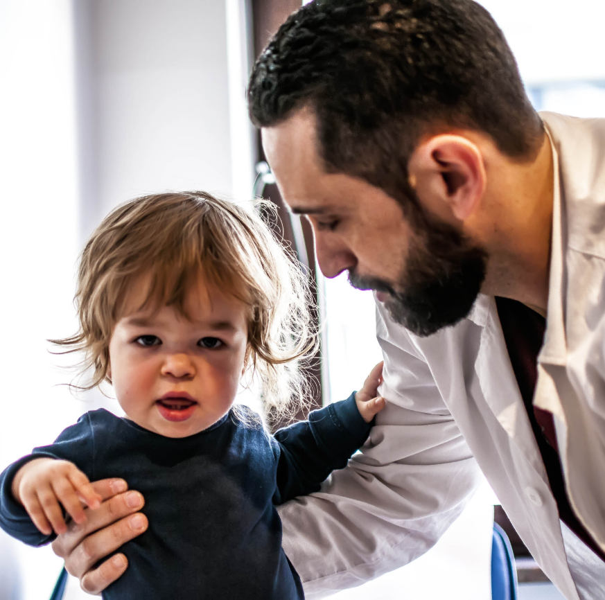 healthcare professionals with child