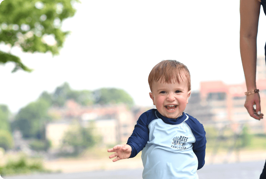 smiling toddler playing outdoors